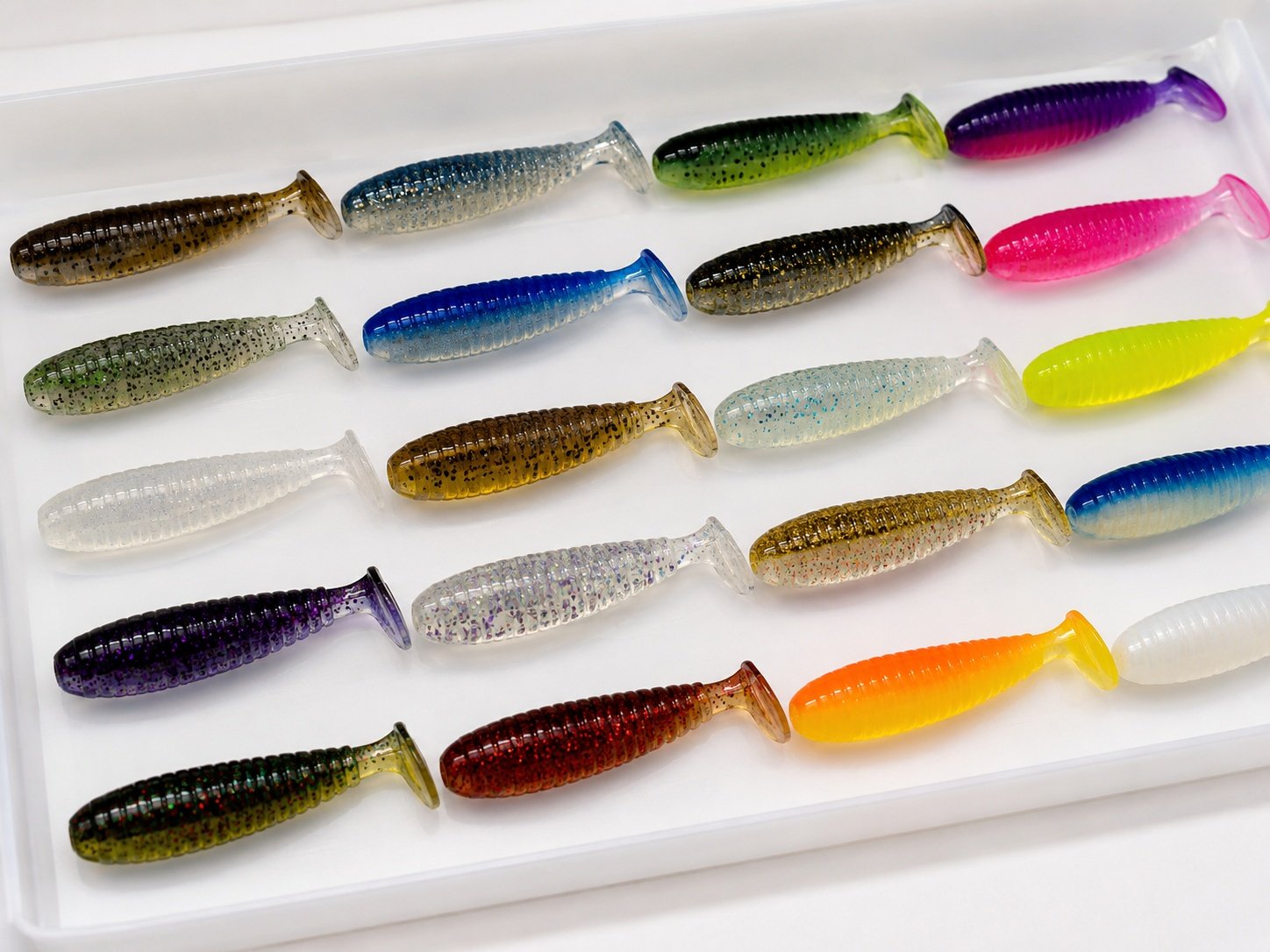 Custom soft bait color samples with glitter flakes and UV effects