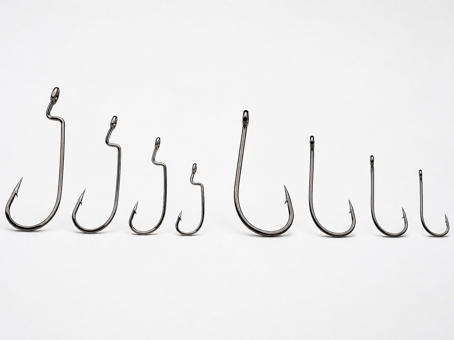 Offset hooks and wide gap hooks for soft bait rigging